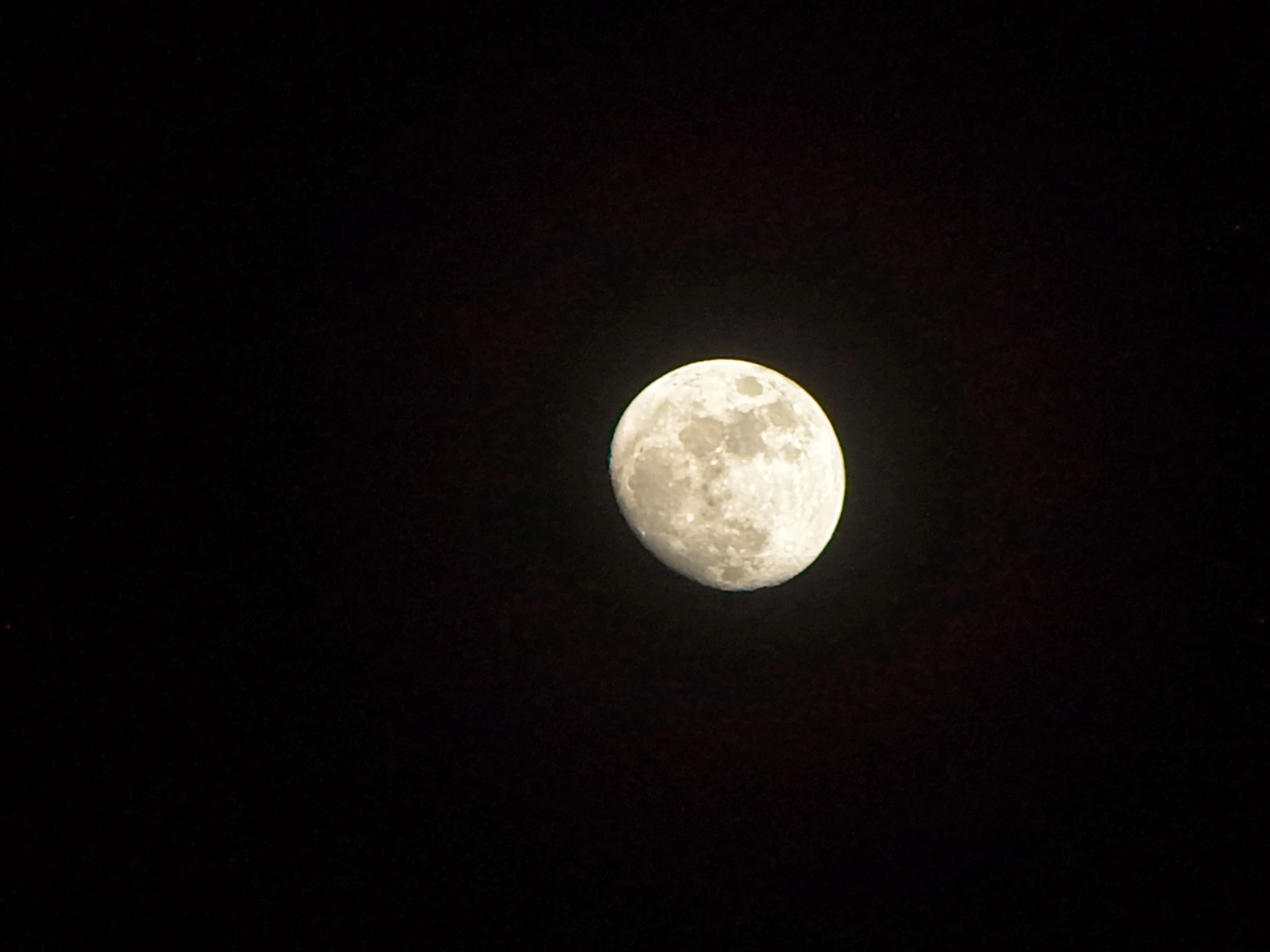 Moon against the dark sky, photographed by Mamathesh Gowda