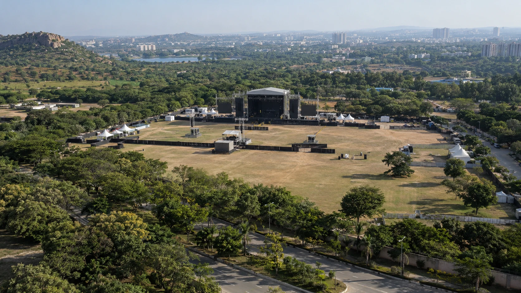 Illustrative wide aerial view of a concert venue and surrounding location