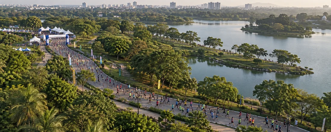 Illustrative aerial view of an outdoor marathon route in a park.