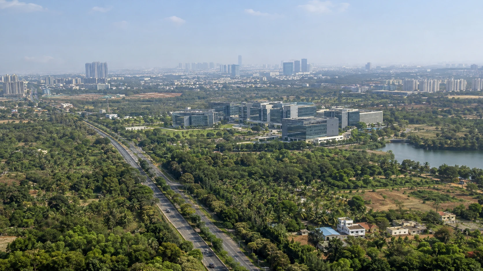 Illustrative wide aerial view of a corporate campus and surrounding location
