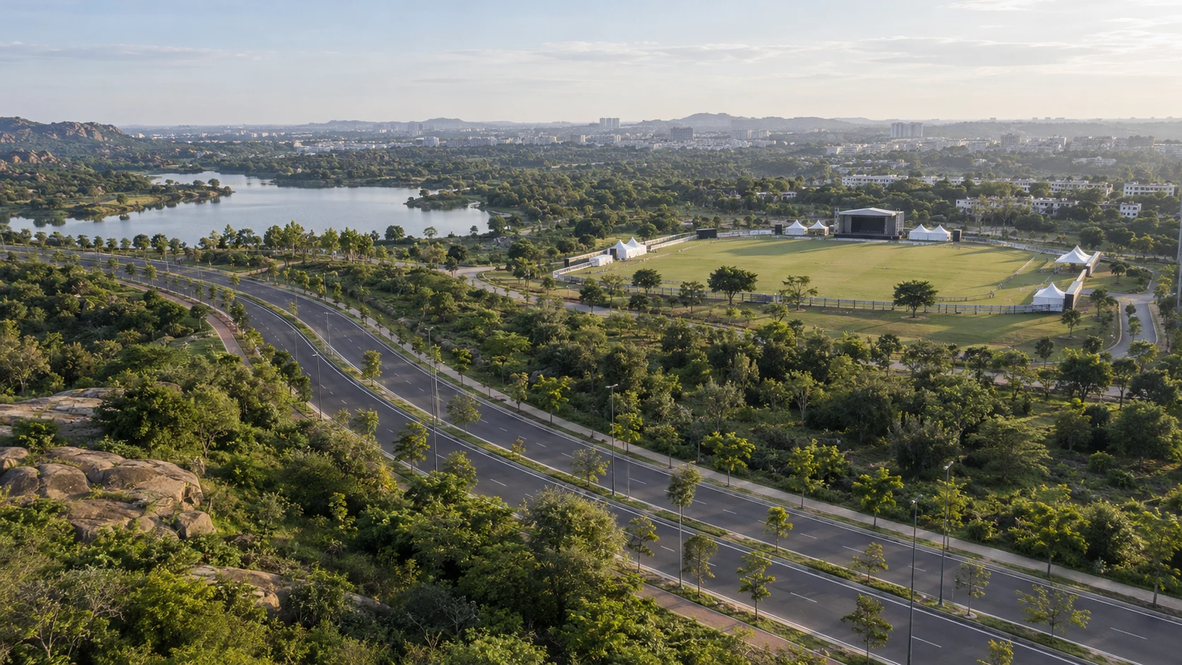 Illustrative wide aerial view of a sports venue and surrounding location